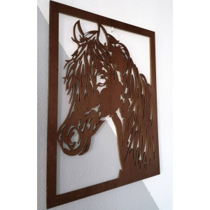Carved painting on a wall of a wooden plywood head horse